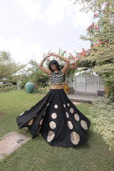 Gorgeous black designer lehenga with shimmering embellishments and golden accents delivers timeless festive elegance.