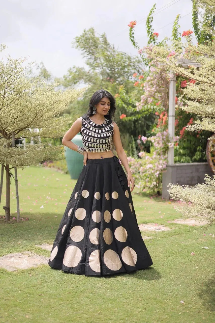 Designer festive lehenga crafted with shimmering mirror embellishments and premium fabric for a sophisticated ethnic look.