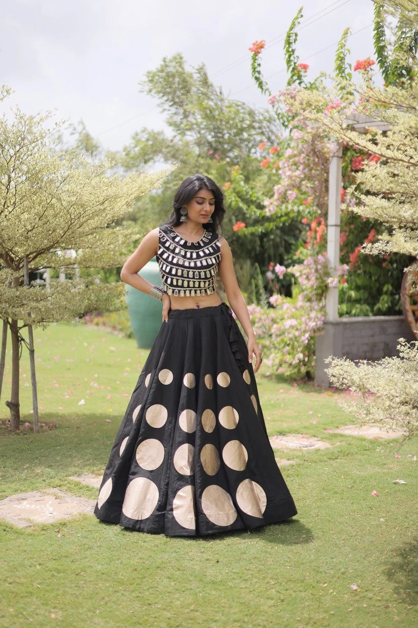 Designer festive lehenga crafted with shimmering mirror embellishments and premium fabric for a sophisticated ethnic look.