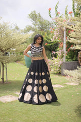 Designer festive lehenga crafted with shimmering mirror embellishments and premium fabric for a sophisticated ethnic look.