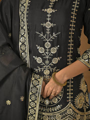 Black outfit with intricate gold embroidery on a plain background