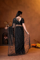 Stunning black ethnic saree showcasing all-over sequins work, delicate bead detailing, and timeless traditional craftsmanship.