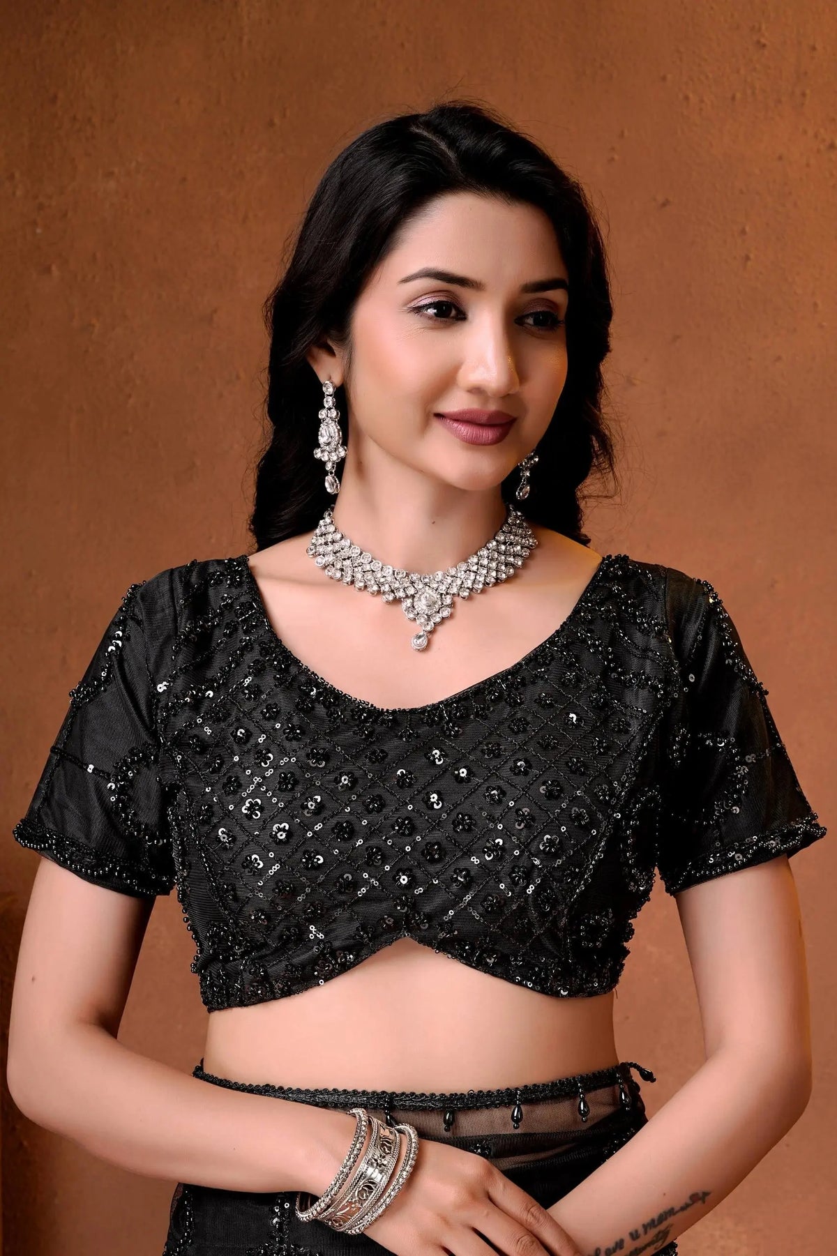 Beautiful Indian embroidered saree with a contemporary silhouette, sparkling embellishments, and sophisticated elegance.