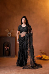 Elegant black designer saree featuring shimmering sequins embroidery and intricate handcrafted detailing for a luxurious festive look.