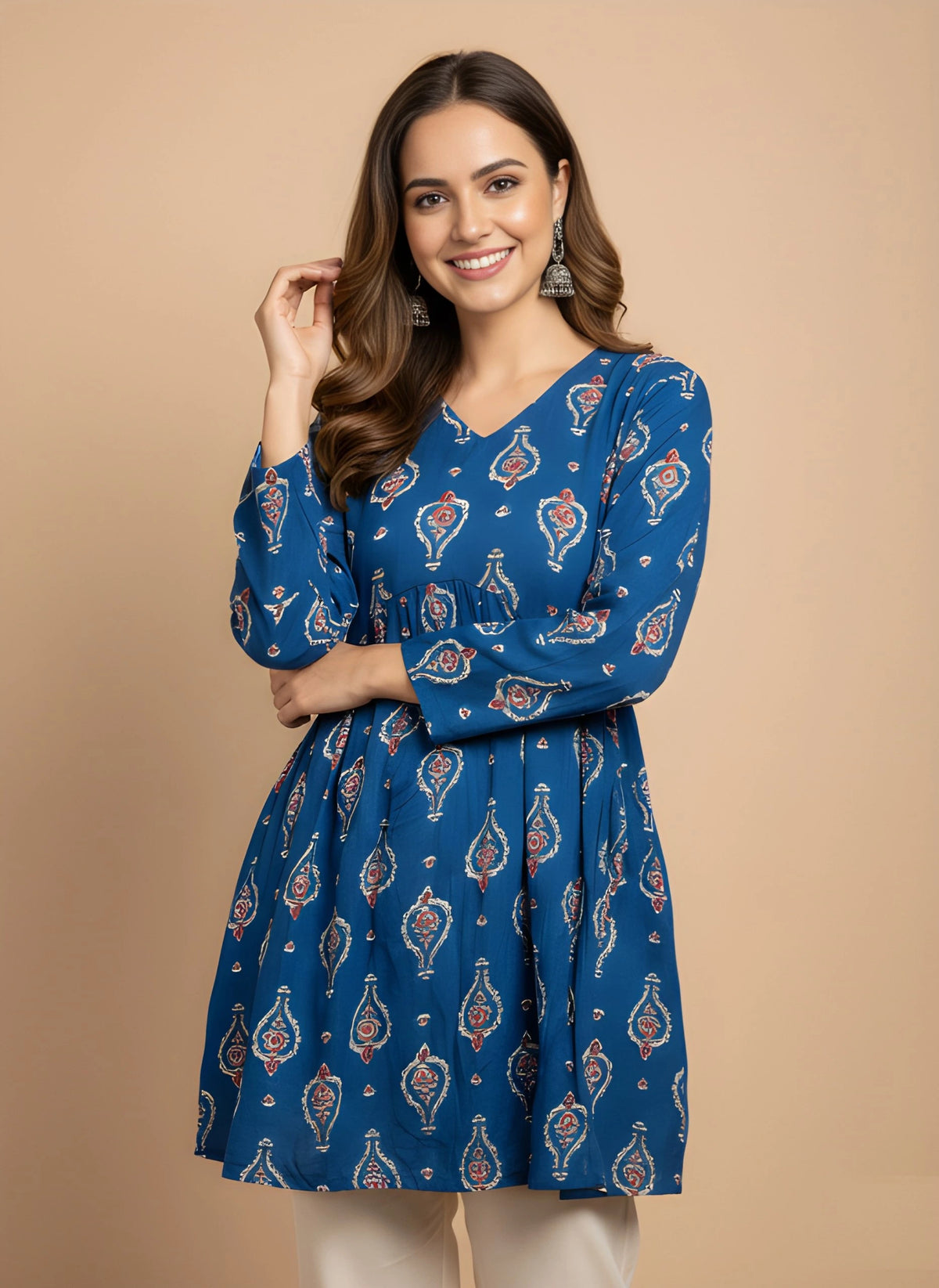 Woman wearing a blue patterned dress on a beige background