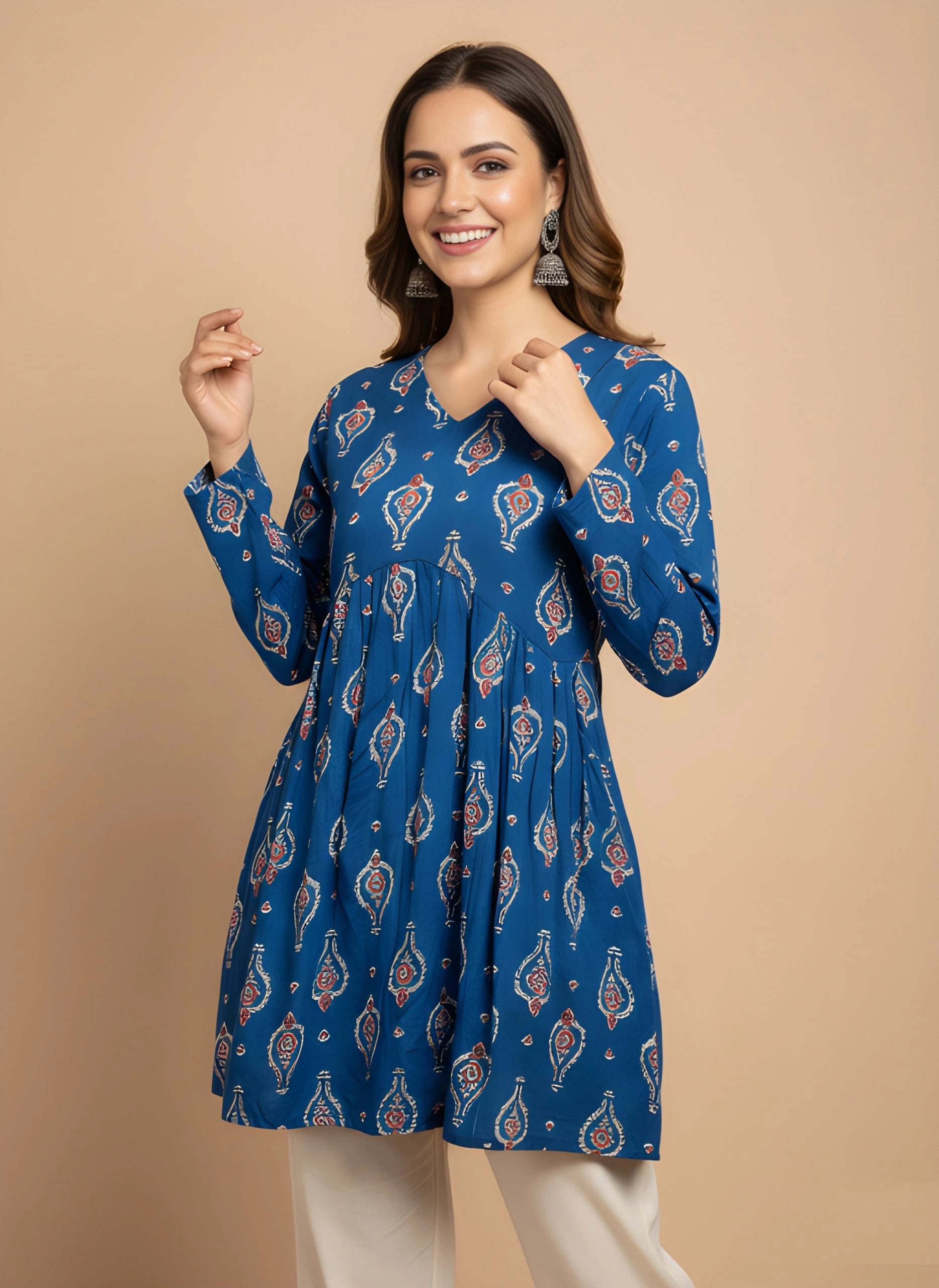 Woman wearing a blue patterned dress against a beige background