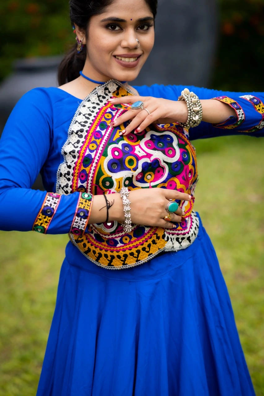 Woman holding a colorful embroidered bag outdoors