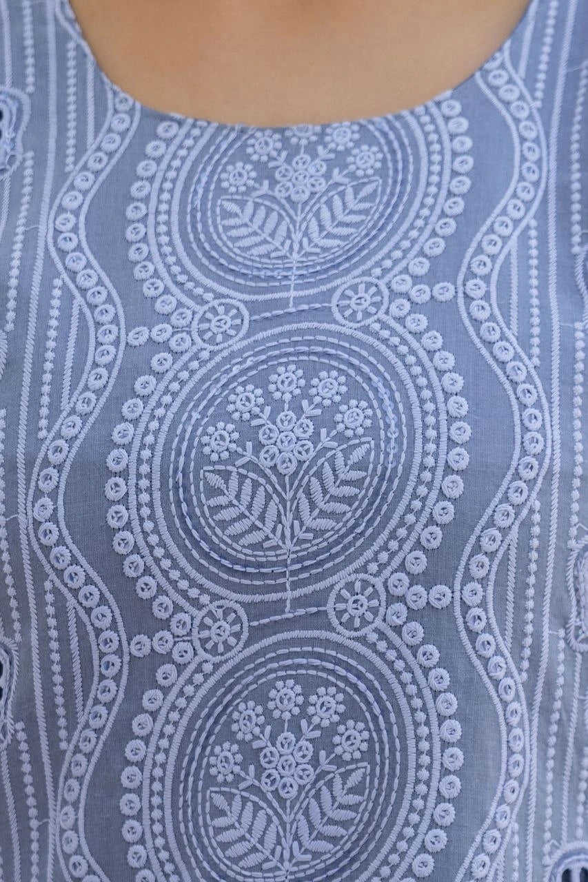 Close-up of a blue patterned fabric with circular designs.