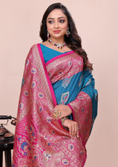 Woman wearing a pink and blue saree with a beige background