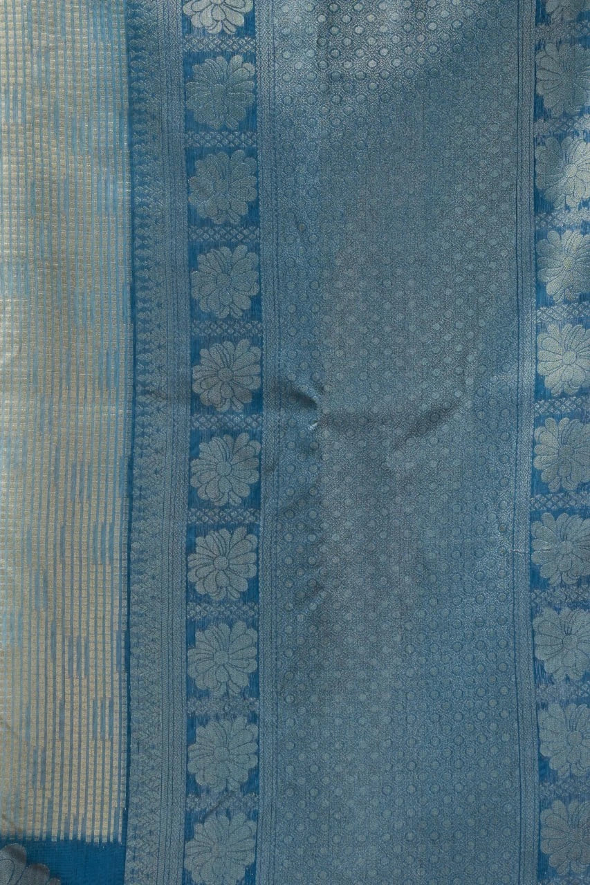 Blue fabric with floral patterns on a textured background