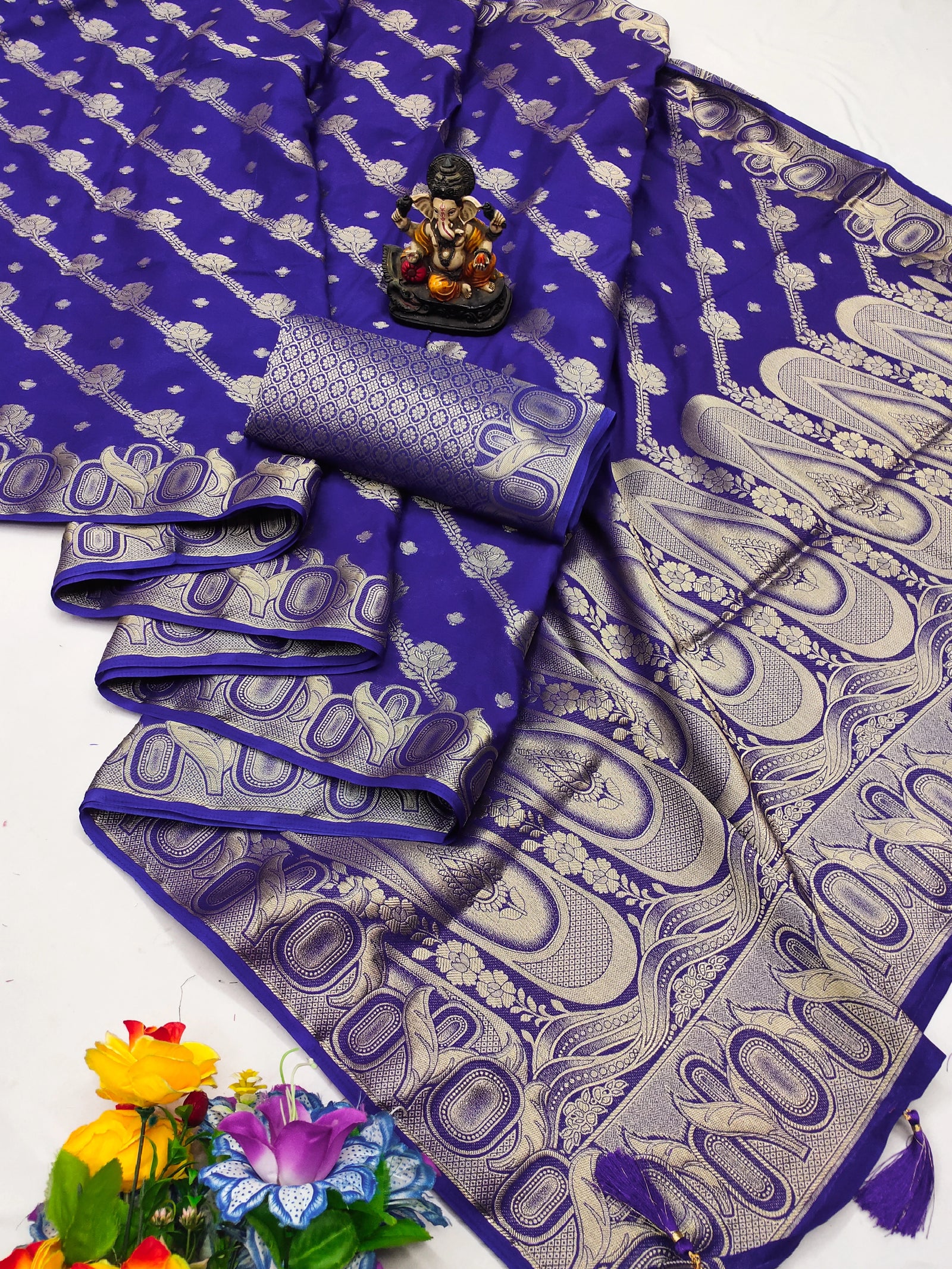 Purple saree with white patterns on a white background