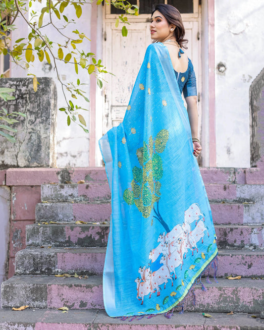 Woman wearing a blue saree with floral patterns on steps outdoors