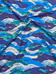 Close-up of fabric with blue and purple wave pattern