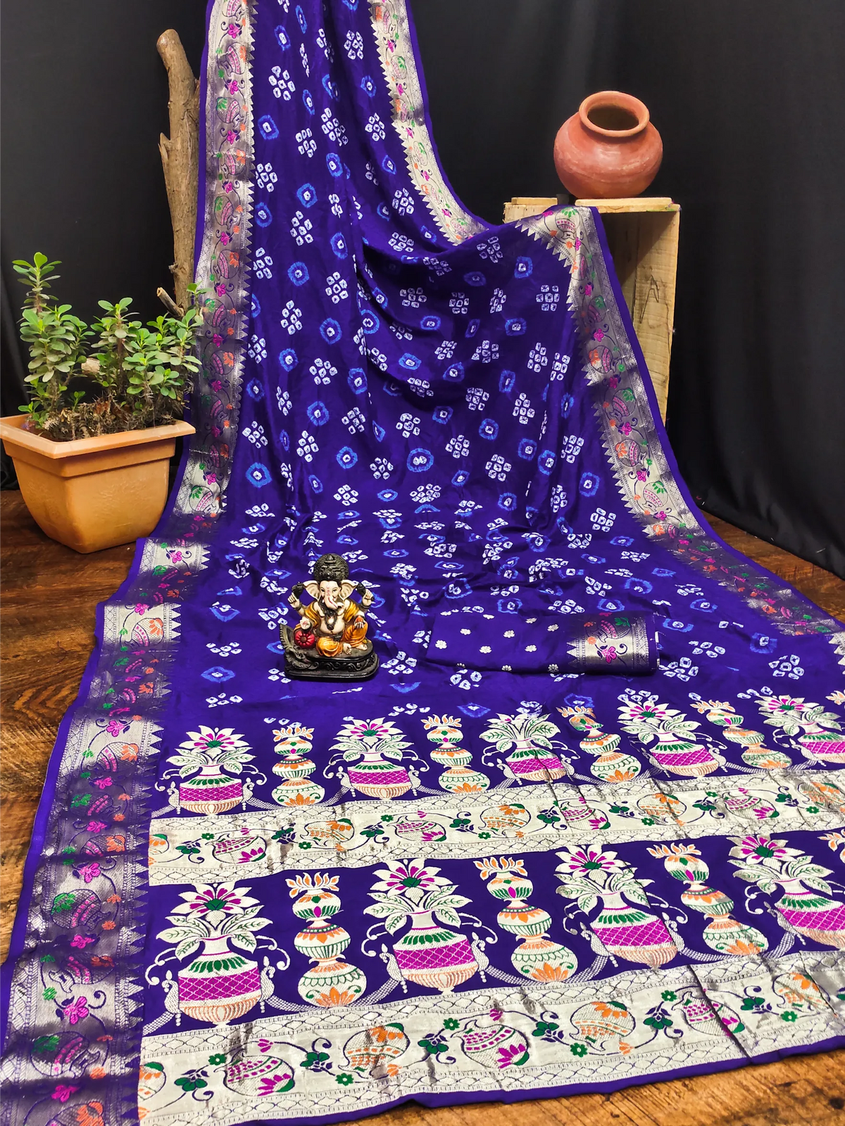 Blue saree with white floral patterns on a wooden surface
