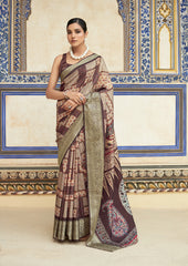 Woman wearing a traditional saree in a decorated room