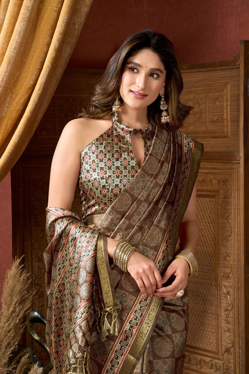 Woman in traditional attire standing in a decorated room with wooden paneling and curtains.