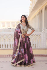 Woman in a traditional outfit with a floral pattern standing on a decorative porch.