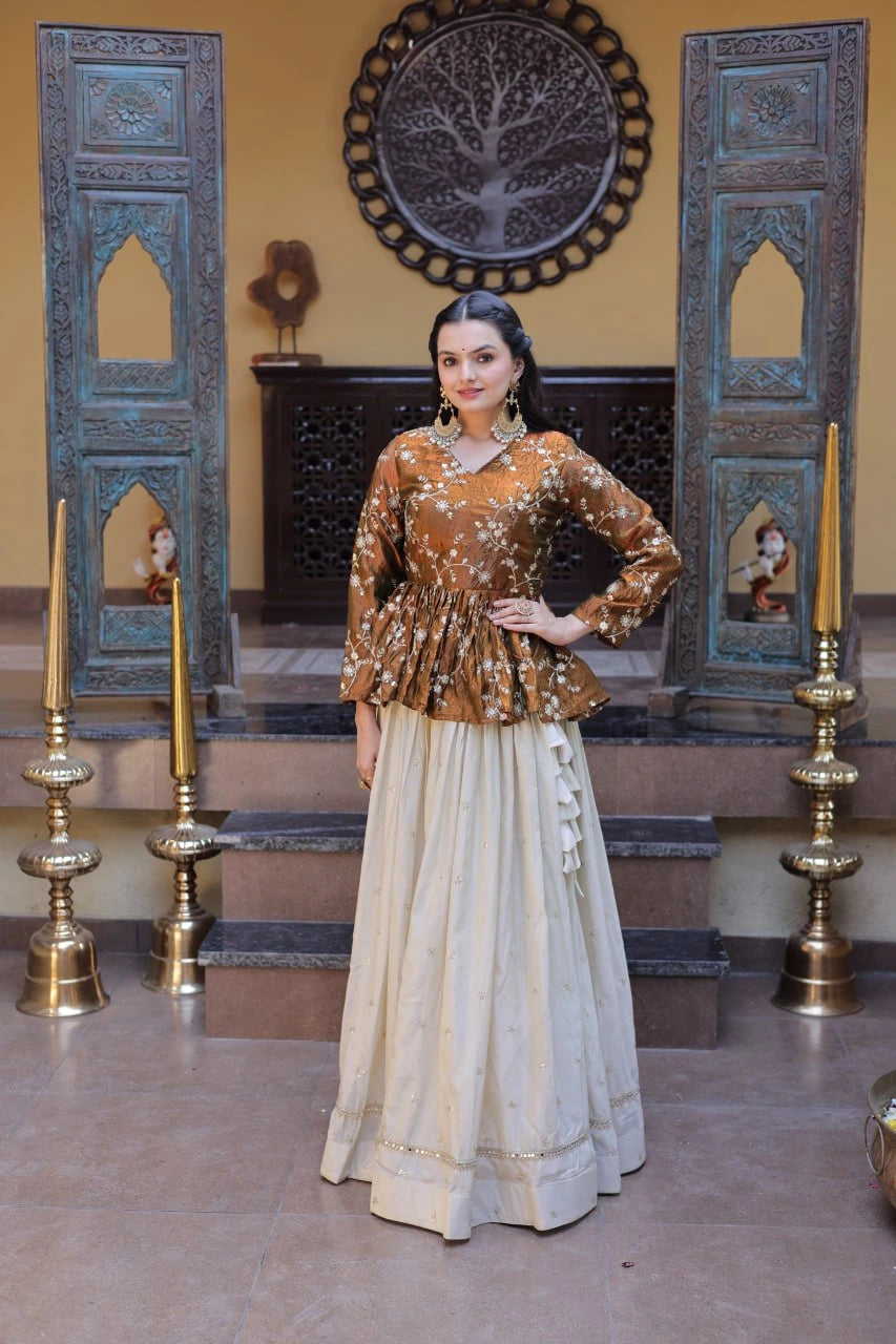 Woman in traditional outfit standing in a decorated room with ornate doors and candles.