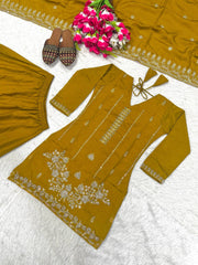 Mustard yellow traditional outfit with floral patterns on a white background