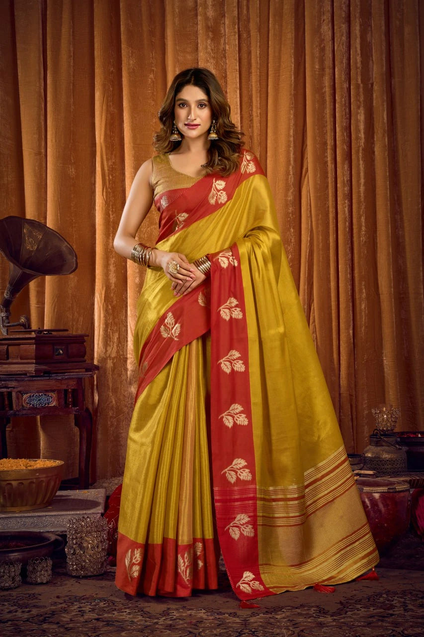 Woman wearing a yellow and red saree with a vintage background