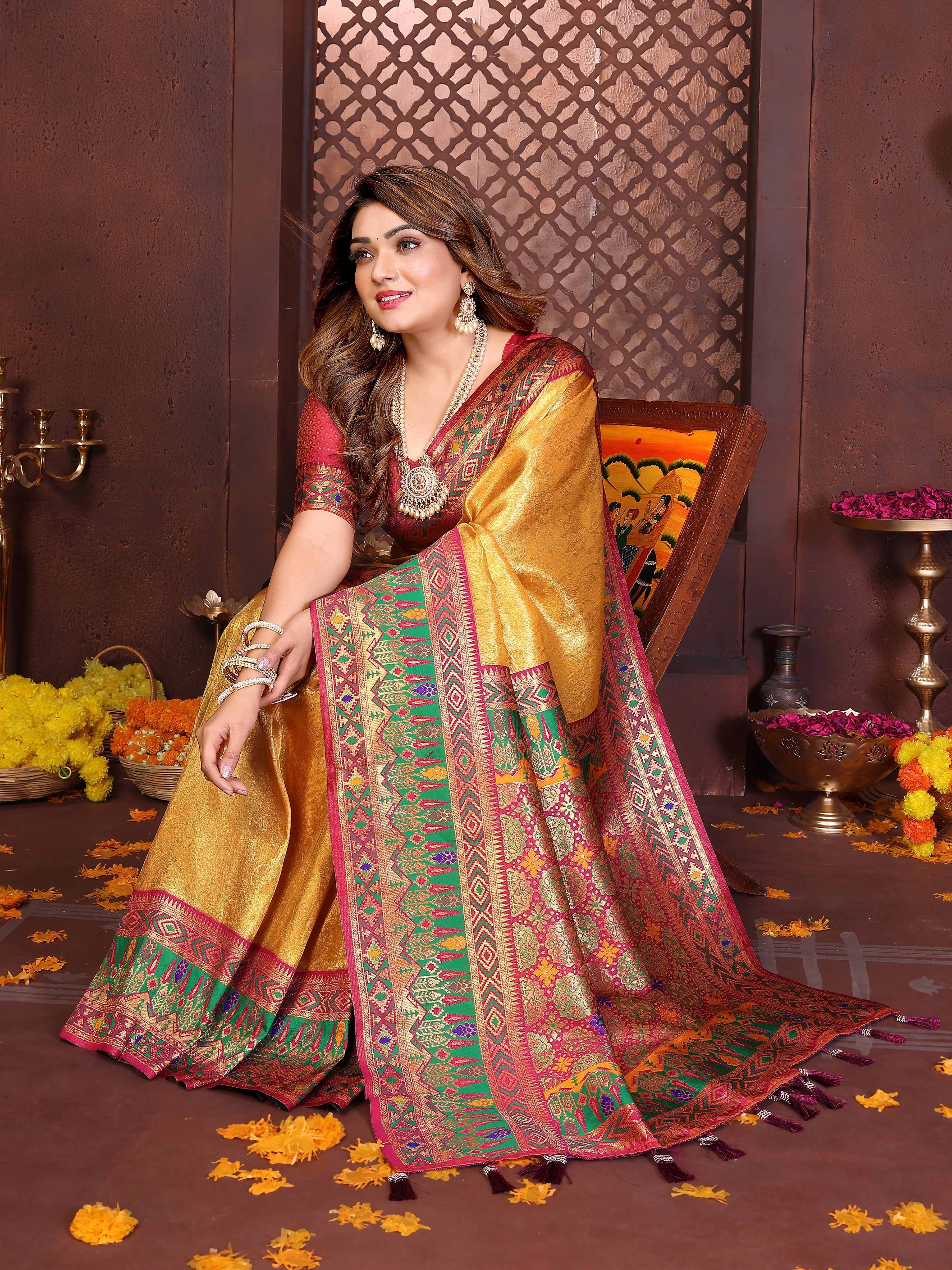 Detailed view of handcrafted Banarasi silk saree in brown-yellow tones with shimmering zari design.