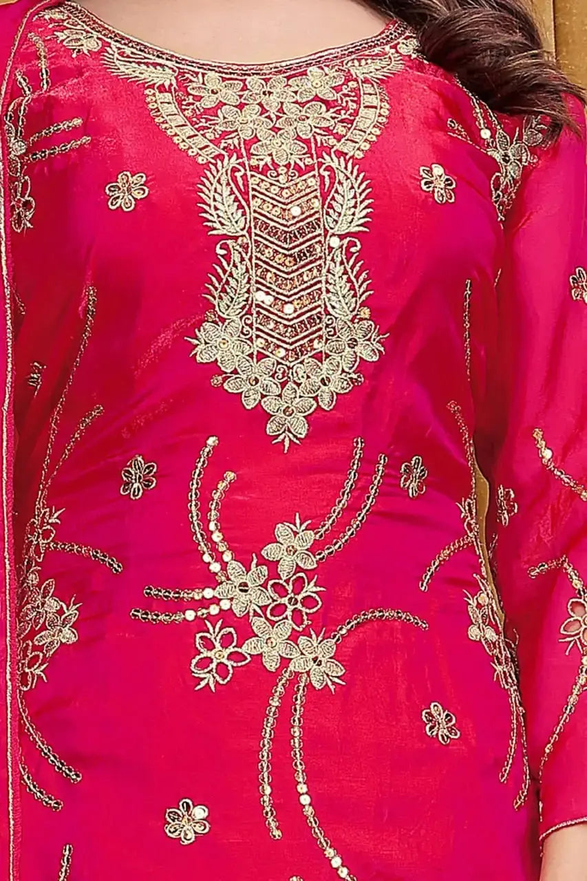 Sequins and Floral Embroidery Work Close-Up on Crimson Red Suit