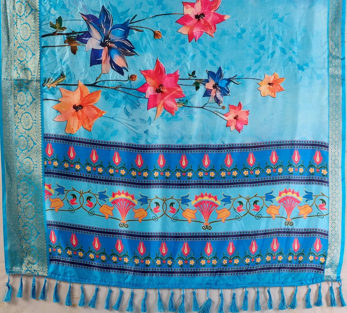 Women's Blue Printed Saree with Vibrant Floral Design, Rich Border Weaving, and Decorative Tassel Pallu