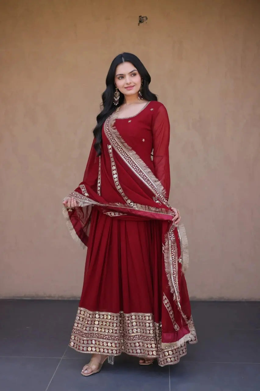 Dark Maroon Anarkali Suit Model Holding Tassel Border Dupatta KU222