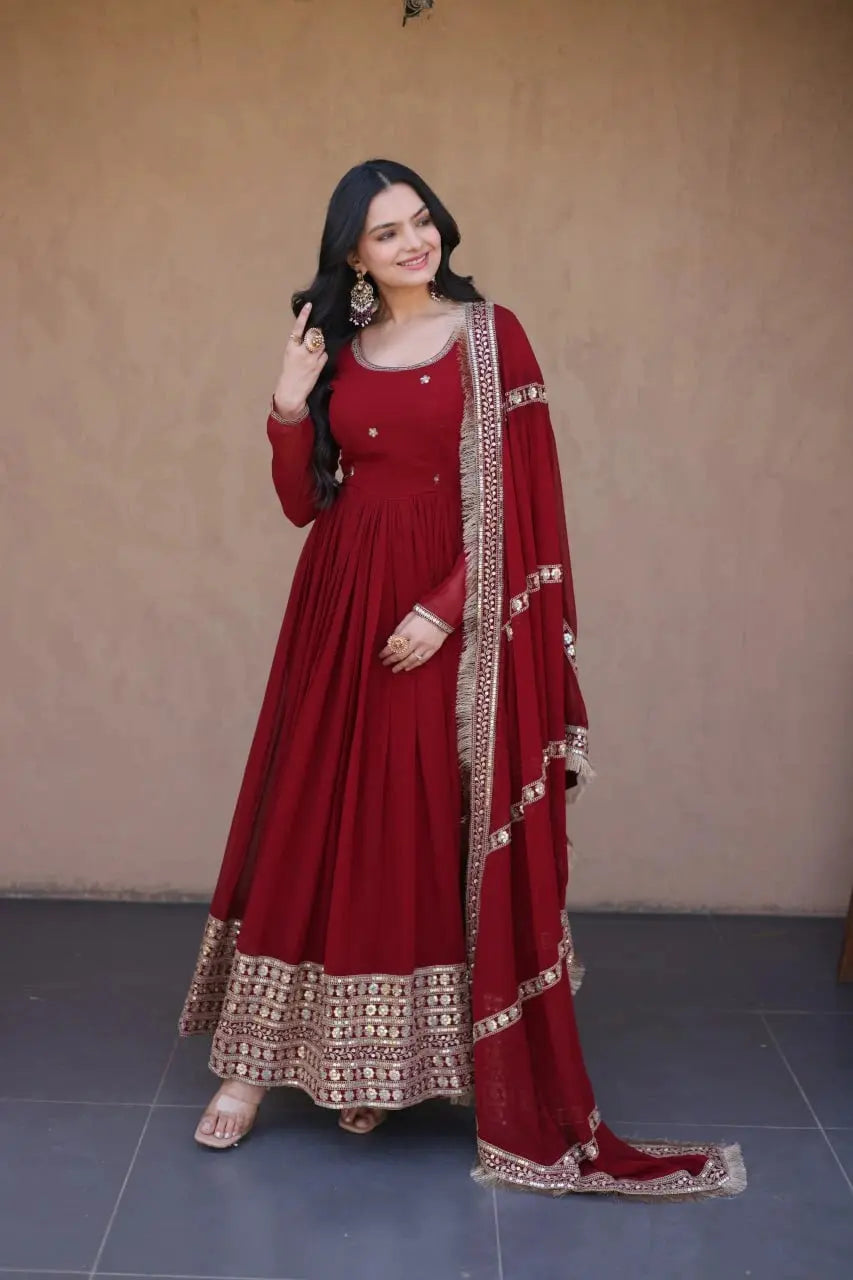 Dark Maroon Pipe Beads Anarkali Suit – Model Posing with Tassel Dupatta and Gold Jewelry