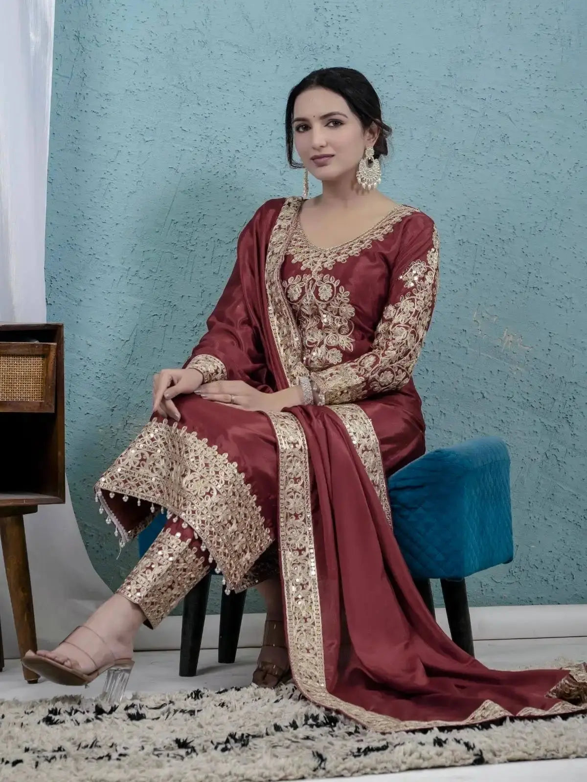 Dark Maroon Sequins Embroidered Suit Seated – Showing Pant Hemline Embroidery Detail