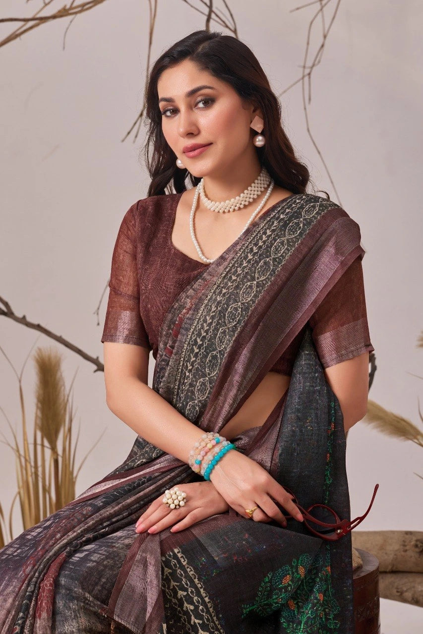 Woman wearing a traditional saree with a neutral background