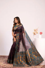 Woman wearing a traditional saree with a floral background