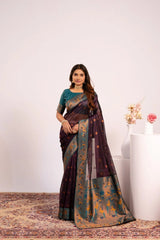 Woman wearing a traditional saree with a floral background