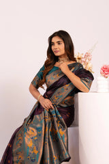 Woman wearing a traditional saree with a floral background