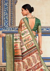 Woman wearing a traditional saree with intricate patterns in a decorative setting