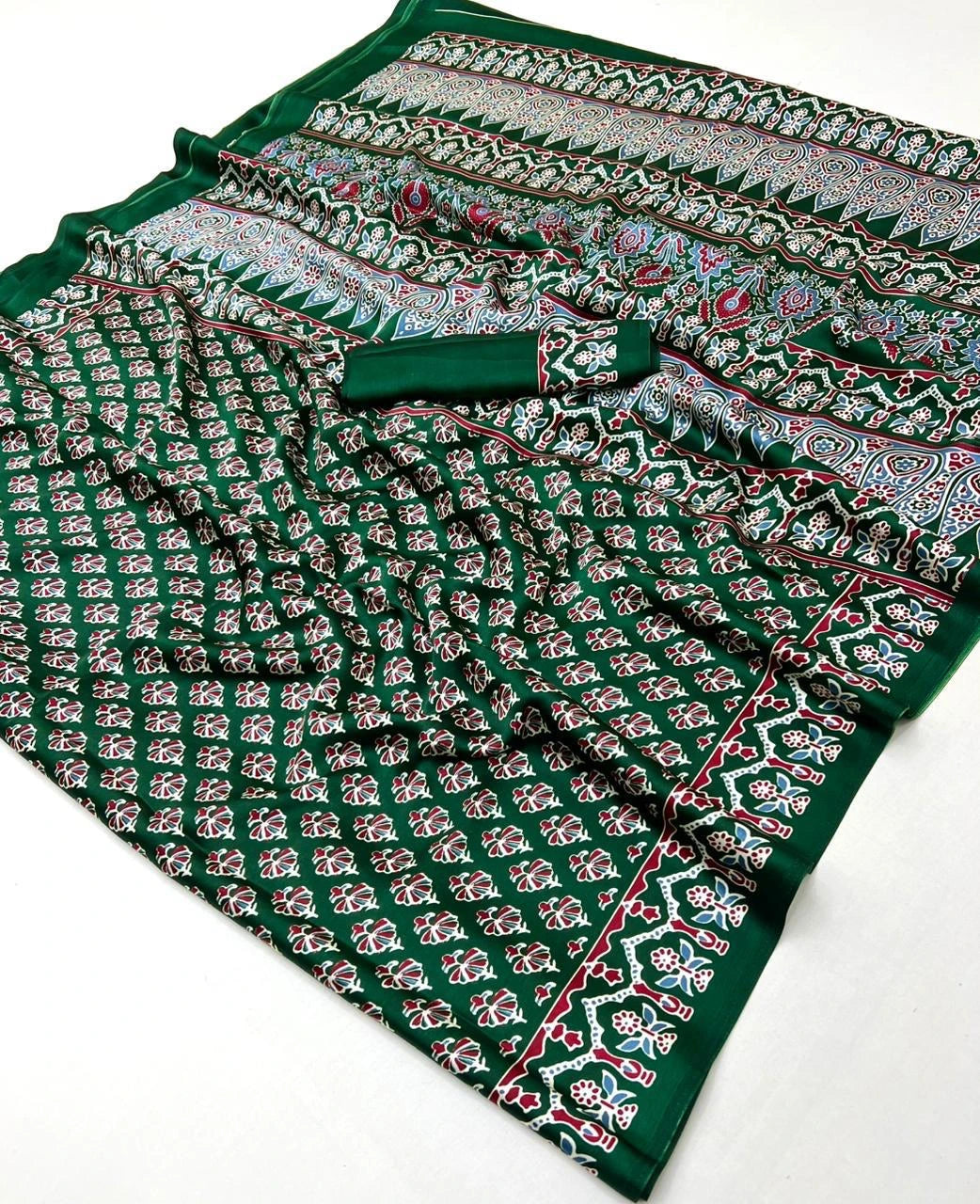 Green fabric with floral pattern on a white background