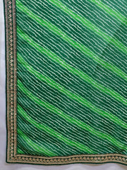 Green fabric with wavy pattern and gold border on a white background