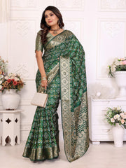 Woman wearing a green saree with a white background