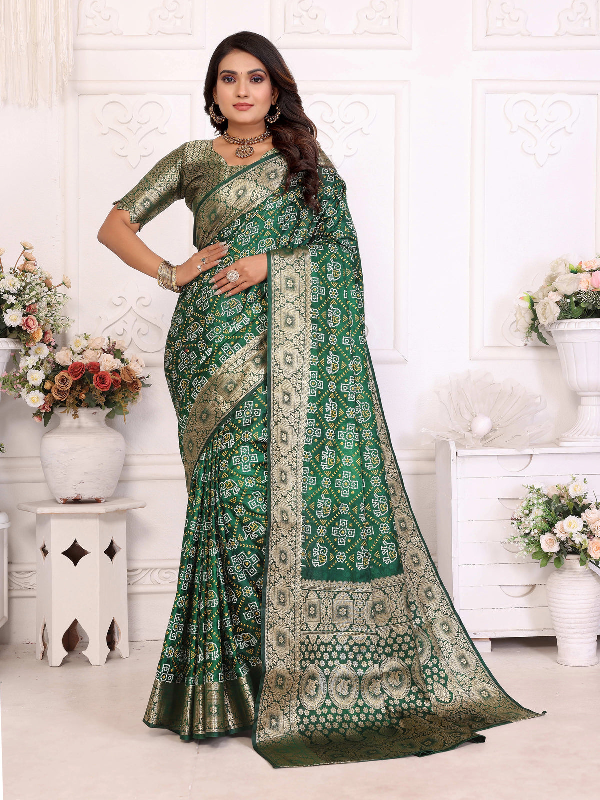 Woman wearing a green saree with a white background