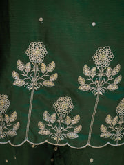 Green fabric with white floral embroidery