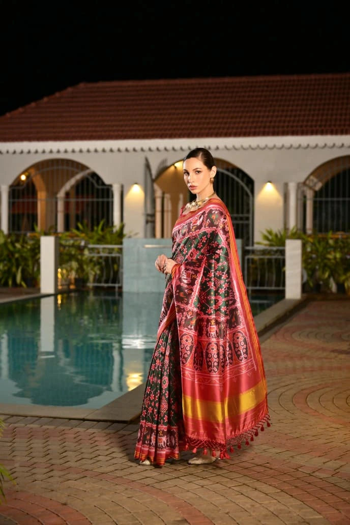 Detailed product listing of dark green Ikkat print Patola silk saree from Kalyanja Fashion