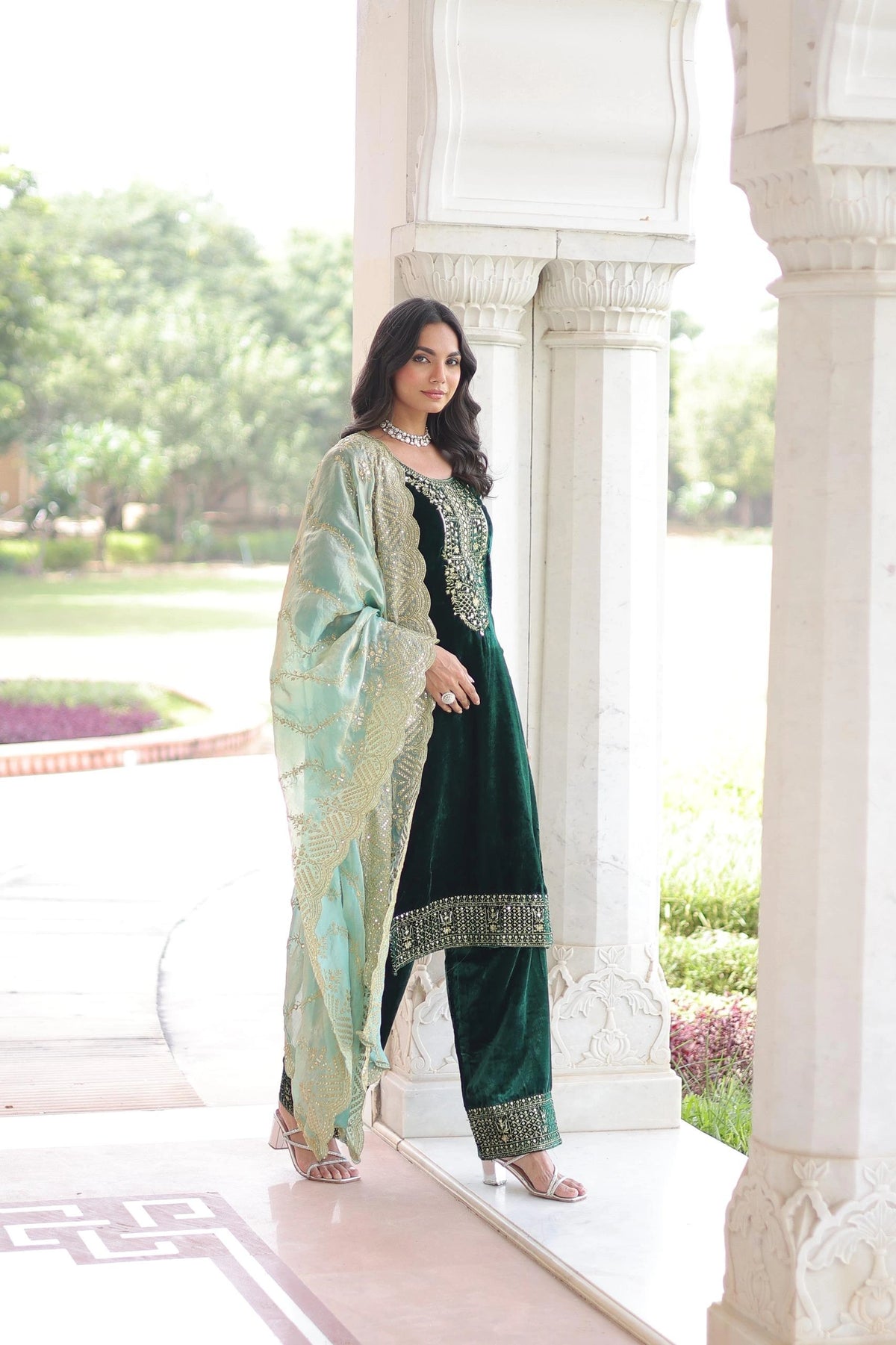 Designer navy velvet kurta set with ornate embroidery and a sheer dupatta, perfect for weddings and festive occasions.