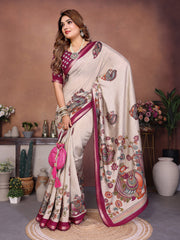 Woman wearing a traditional saree with intricate patterns in a decorated indoor setting