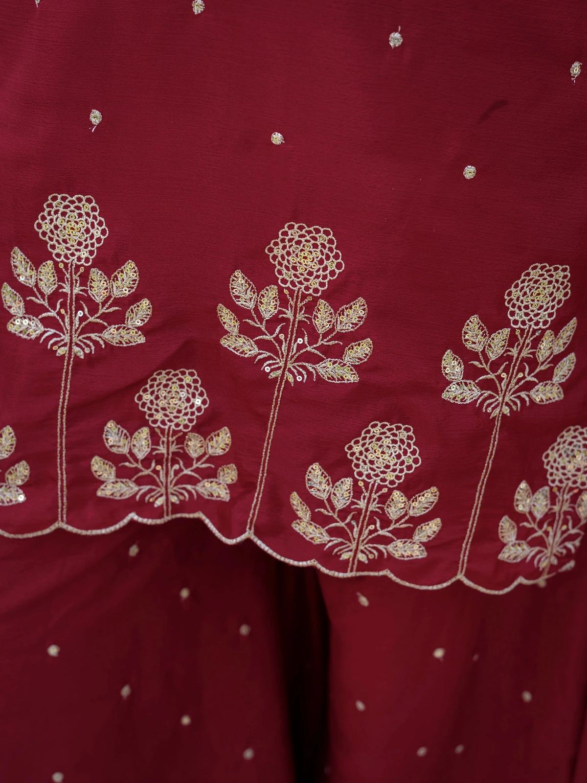 Red fabric with white floral embroidery
