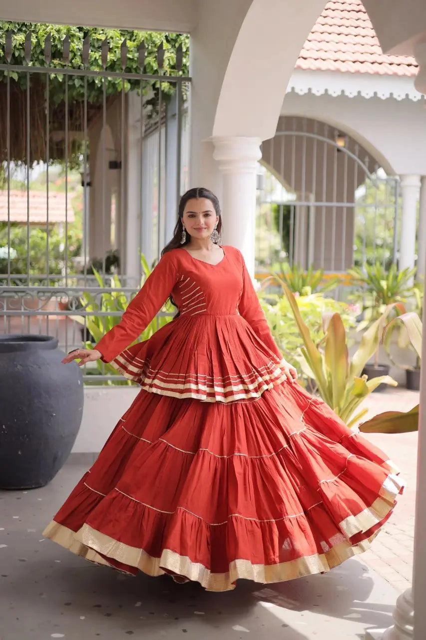 Festive Wear Burnt Orange Lehenga Set featuring Full Sleeve Blouse, Layered Skirt, and Elegant Gota Border