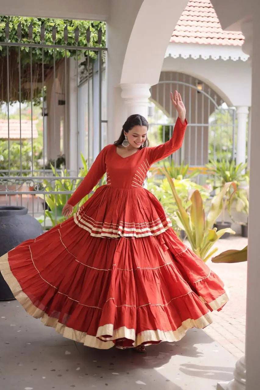 Elegant Rust Orange Lehenga Choli Set with Multi Layer Flare and Rich Golden Hemline for Wedding Functions