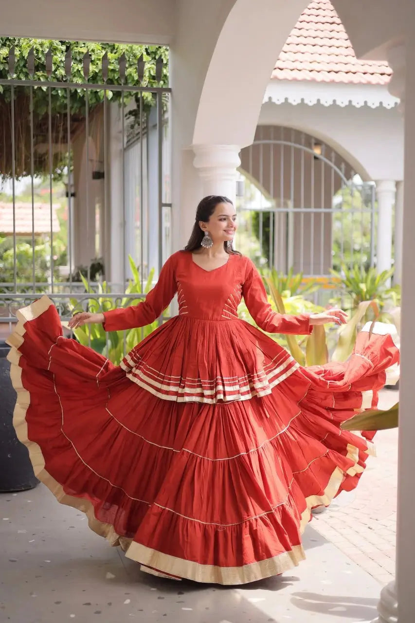 Beautiful Burnt Orange Ethnic Lehenga with Full Sleeves, Tiered Ghera, and Festive Gota Patti Accents