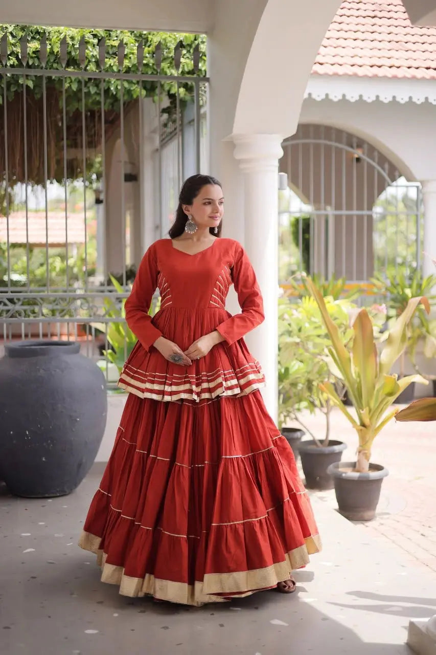 Elegant Rust Orange Layered Lehenga Choli with Golden Gota Patti Border, Full Sleeve Blouse, and Grand Festive Appeal