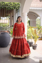Women's Festive Rust Orange Lehenga Dress with Layered Ghera, Golden Border Accents, and Timeless Ethnic Style