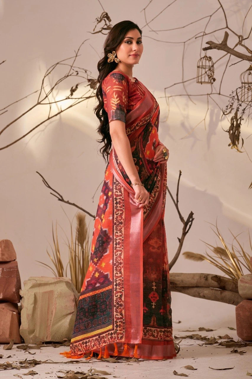 Woman in a traditional saree with a decorative pattern against a neutral background